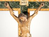 statue of jesus on a cross with the word inri on it