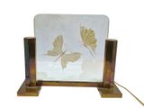 a picture of a mirror with a butterfly design on it