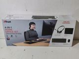 boxed box of a computer set with a woman sitting at a desk