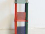 a colorful shelf with two bottles on top of it