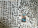 a picture of a refrigerator covered in coins and magnets