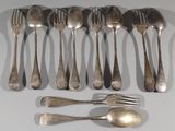a lot of silver spoons and forks on the table
