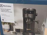 a box with a picture of a coffee maker inside of it
