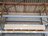 a stack of wooden planks sitting on a pallet