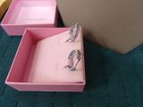 pink box with two rings in it and a pink box with two rings in it