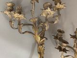 pair of antique brass candelabs with flowers and leaves