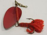 a red fishing hook with a fish hook attached to it