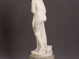 an image of a statue of a woman standing on top of a pedestal