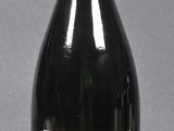 a bottle of wine that is sitting on a table