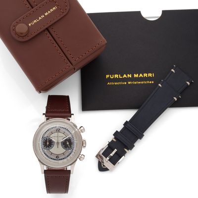 an image of a watch and a wallet on a white surface