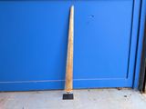 a baseball bat leaning up against a blue door