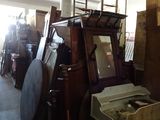 several pieces of furniture are stacked together in a room