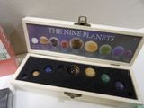 a box with nine planets inside of it on a table