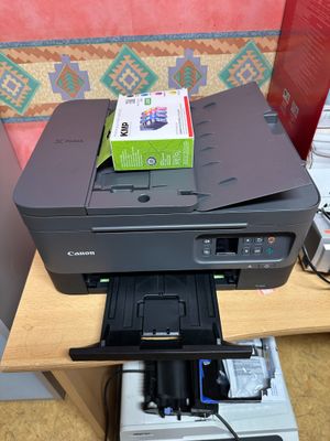 a printer that is sitting on top of a desk