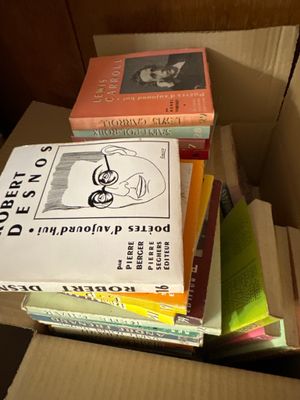 a box full of books sitting on top of a table