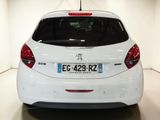 the back of a white car with a red tail light