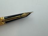 an image of a pen that is laying on top of a table