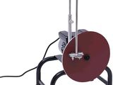 a machine that is sitting on a stand on a white background