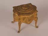 an image of a gold box with a lid on a white surface