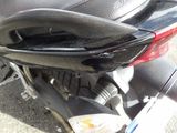 a close up of a motorcycle with a black seat
