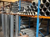 a large amount of pipes and tubes in a warehouse