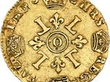 a gold coin with a crown on top of it