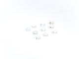a lot of different types of ear plugs on a white surface