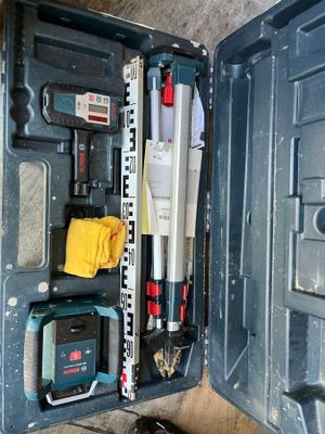 a tool box with tools inside of it on the floor