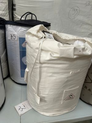 a lot of bags that are sitting on a shelf
