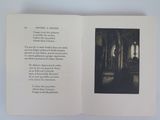 an open book with a picture of a man in a church
