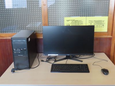 a desktop computer sitting on a desk with a keyboard and mouse