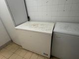 a white refrigerator and a freezer in a room