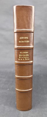 four books stacked on top of each other on a table