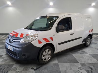 the white van is parked on a checkered floor in the garage