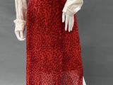 an image of a mannequin wearing a red leopard print skirt