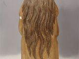 an image of a figurine of a woman with long hair