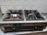 two burners on top of a stove in a kitchen