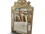 a mirror that is sitting on the floor in front of a wall