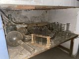 a wooden table with a bunch of glassware on it