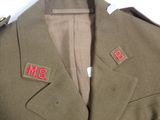 an image of a military uniform jacket with red letters on it