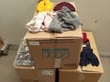 a pile of boxes and gloves sitting on top of a pallet