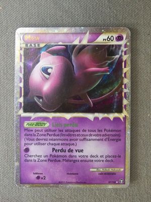 a close up of a purple pokemon card on a table