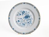 a blue and white plate with blue flowers on it