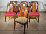 six chairs that are sitting on a tile floor