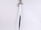 a close up of a sword on a white surface with a white background