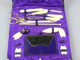 a purple case filled with tools and a pair of scissors