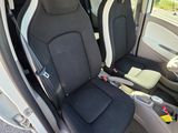 two seats in the back of a car that are black and white