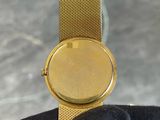 an image of a person holding a watch in their hand