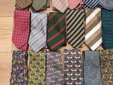 a lot of ties laid out on the floor