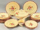 many plates and bowls that are sitting on a table
